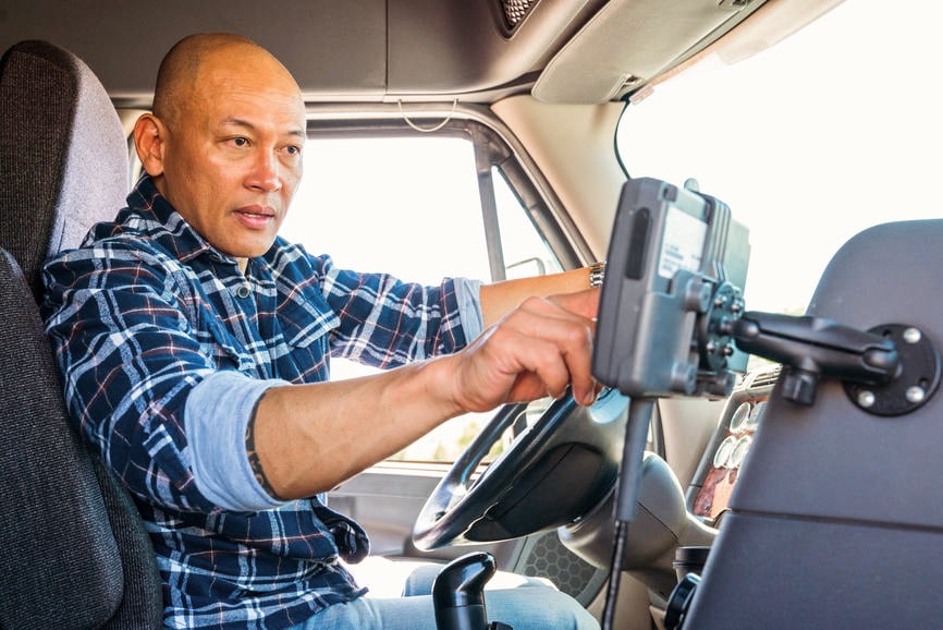Truck Driver - man using mobilecom device